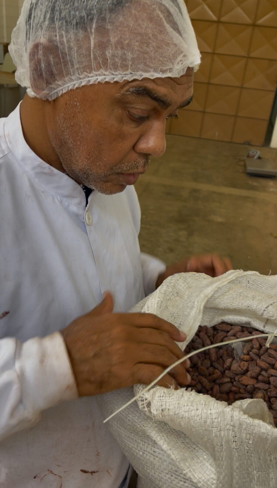 Santos seeing Agroverse cacao beans for the first time at his facility in Itabuna, Bahia